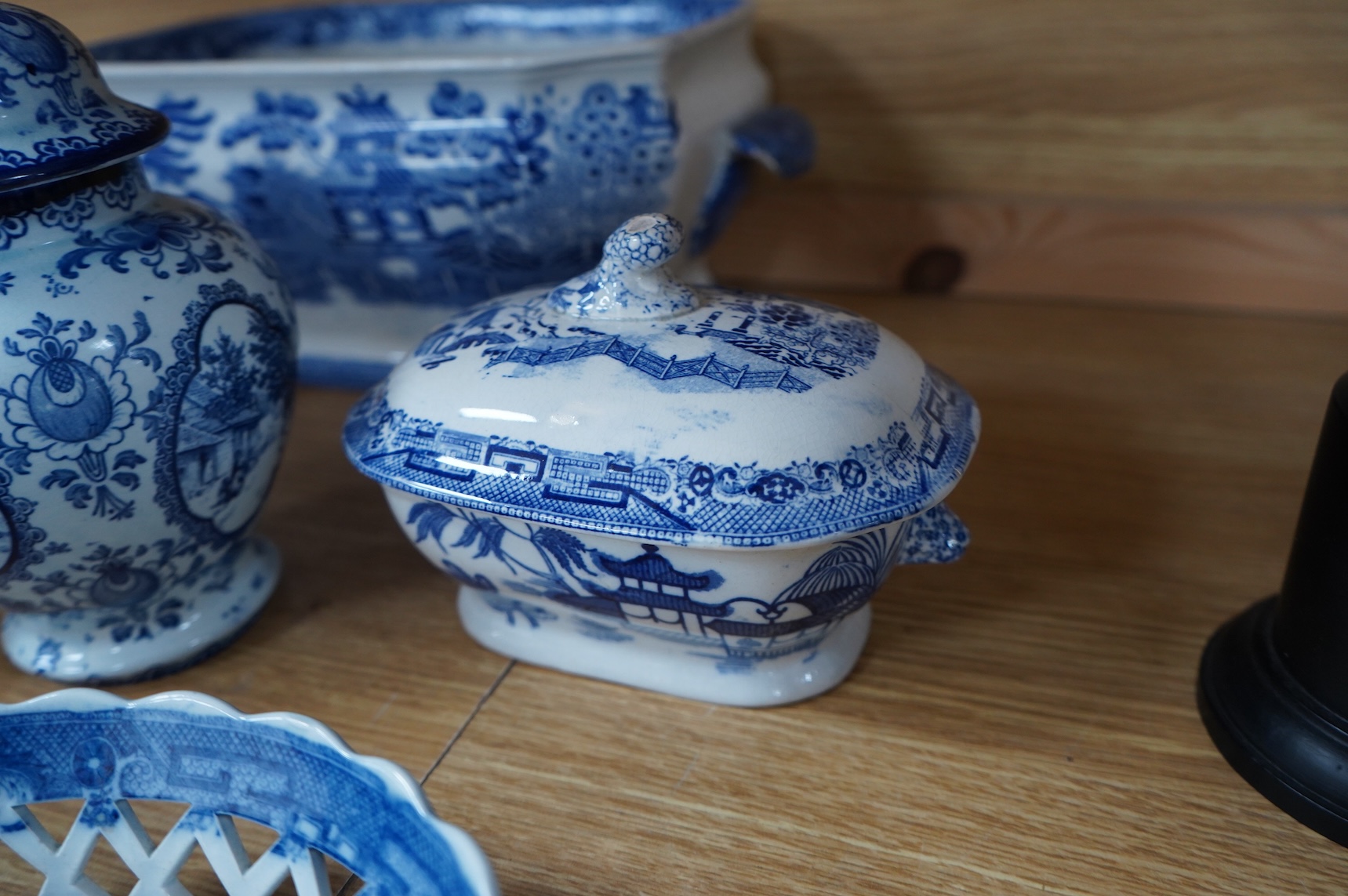 A group of blue and white Willow pattern china, 19th century and later and a Meissen cup and. Saucer. (12).